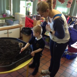 George and his Mummy were very busy planting a sunflower and labelling the pot.